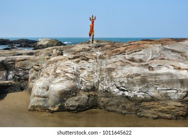 The Face Of The Hindu God Shiva Carved In Natural Stone At The Anjuna Beach In North Goa.India