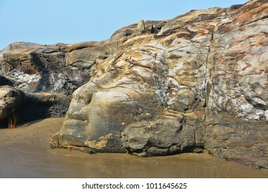The Face Of The Hindu God Shiva Carved In Natural Stone At The Anjuna Beach In North Goa.India