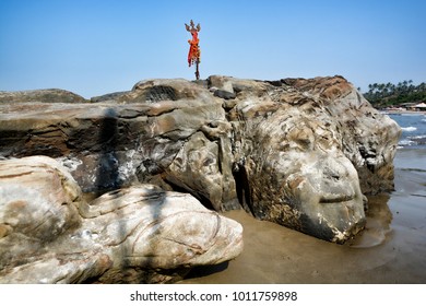 The Face Of The Hindu God Shiva Carved In Natural Stone At The Anjuna Beach In North Goa.India