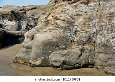 The Face Of The Hindu God Shiva Carved In Natural Stone At The Anjuna Beach In North Goa.India