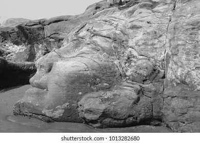 The Face Of The Hindu God Shiva Carved In Natural Stone At The Anjuna Beach In North Goa.India