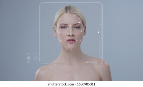 Face ID. Future Technology Concept. Technological Biometric Identification of Young Blonde Beauty Woman Isolated on Dark Grey Background. 3D Facial Recognition and Personal Security. Augmented Reality
