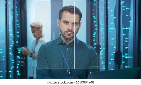 Face ID. Technological Face Detection with 3D Animation. Biometric Future Scanning of Face of Male IT Specialist Working with Laptop in Server Room Data Center. Augmented Reality. Cyber Security and