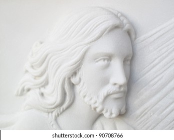 Face Of Jesus Christ  On White Marble Tomb Stone