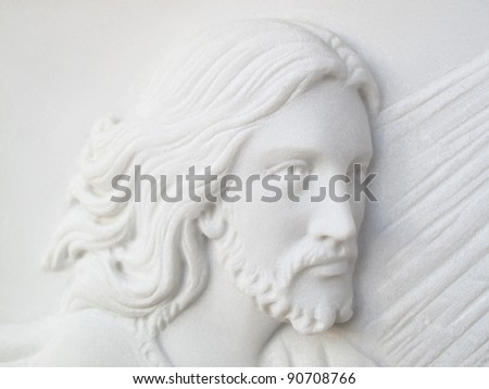 face of jesus christ  on white marble tomb stone