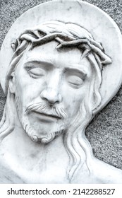 The Face Of Jesus Christ Suffering On The Cross. Bas Relief.