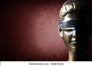 Face Of Lady Justice In Dark Ruddy Background