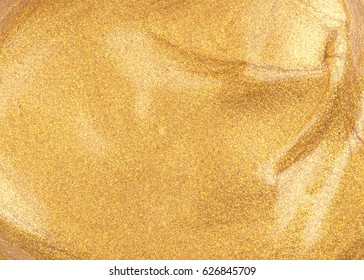 Face make-up liquid golden foundation plain sample; with glitter particles