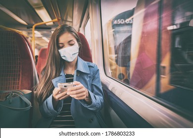 Face mask concept. Woman wearing mandatory mask inside public spaces for transport such as train station and bus. Asian woman passenger using mobile phone with face covering on commute.