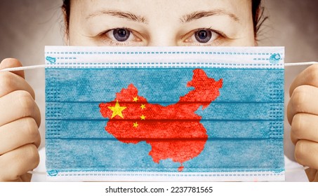Face mask with flag of China. Zero covid in China. Covid 19 outbreak in China - Shutterstock ID 2237781565