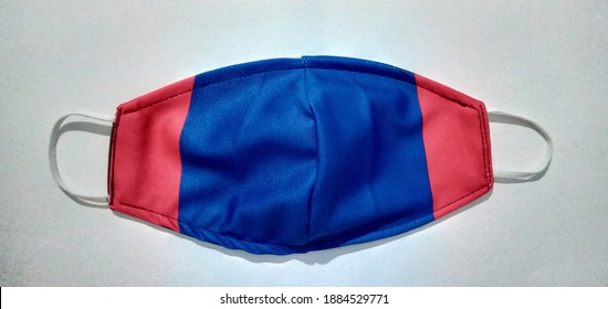 Face mask made out of soft cotton fabric blue and red color. A washable mask to protect us from polluted air and virus. - Shutterstock ID 1884529771