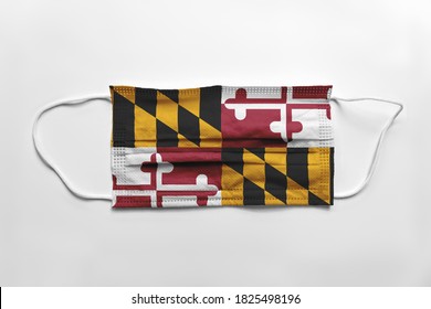 Face Mask With Maryland Flag Printed, On White Background, Isolated Safety Concept