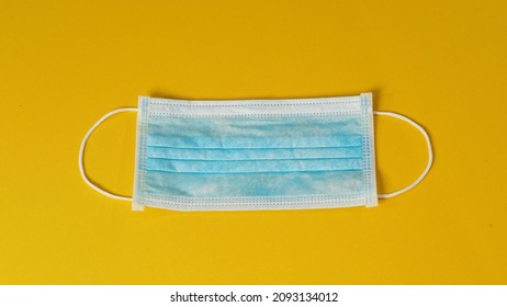 Face Mask Or Medical Mask On Yellow Background. No People