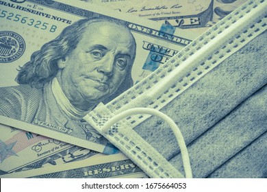 Face Mask On US Dollar Bill Banknote Background. Global Novel Coronavirus (Covid-19) Outbreak Effect To World Economy, Financial Crisis, Investment, Stock Market. Coronavirus Detected In Wuhan, China.