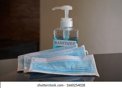 Face masks and hand sanitizer bottle  for washing to help stop spreading covid-19 for public healthcare safety all personal crisis management. Concept Healthcare, Sanitizer, Face Mask, hygiene hands. - Shutterstock ID 1660254028