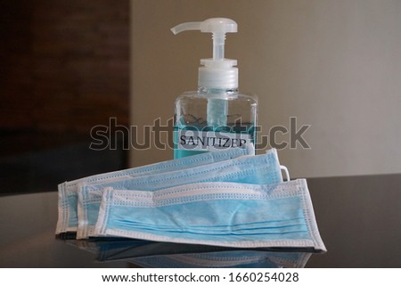 Face masks and hand sanitizer bottle  for washing to help stop spreading covid-19 for public healthcare safety all personal crisis management. Concept Healthcare, Sanitizer, Face Mask, hygiene hands.
