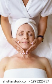 Face massage. Close-up of adult woman getting spa massage treatment at beauty spa salon. Spa skin and body care. Facial beauty treatment. Cosmetology. - Shutterstock ID 1993225757