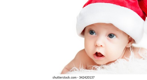 Face Of The Newborn Baby In A Christmas Hat