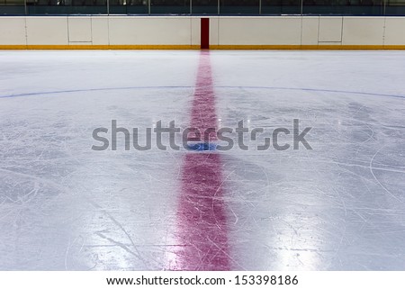 Face off blue spot with red line on hockey rink