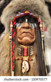  A face of an old Native American Indian in full headdress