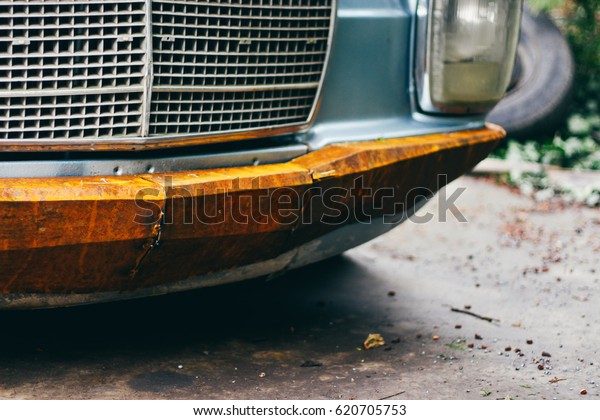 face of old\
retro german car with rust\
elements
