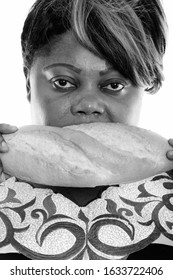 Face Of Overweight African Woman Eating Bread