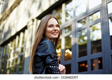 Face portrait of attractive woman in black leather jacket - Shutterstock ID 1528483397