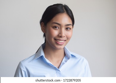 face portrait of happy smiling girl; portrait of positive relaxed happy smiling asian woman smiles on isolated background; young adult southeast asian woman model - Shutterstock ID 1722879205