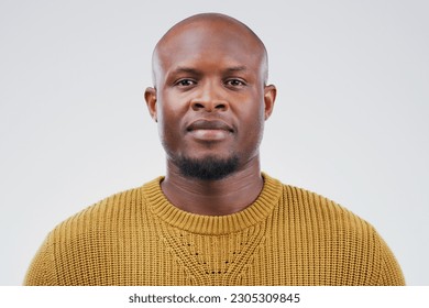 Face portrait, serious and black man in studio isolated on a white background. African, bald and male person from South Africa with fashion, style and pose with aesthetic clothes for confidence.