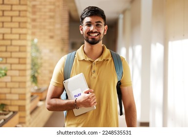 Face portrait, student and man in university ready for back to school learning, goals or targets. Scholarship, education and happy, confident and proud male from India holding tablet for studying. - Powered by Shutterstock