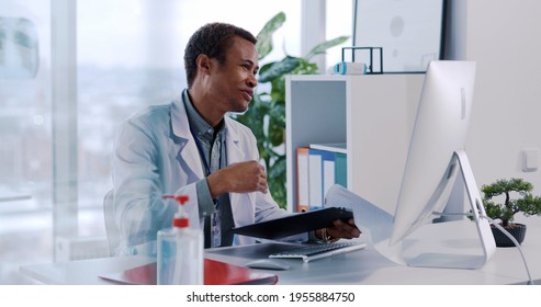 Face Portrait Of Young Healthcare Doctor Specialist Videochatting On Pc Computer Monitor Speaking Webcam To Patient Explaining Diagnosis. Remote Consultation.