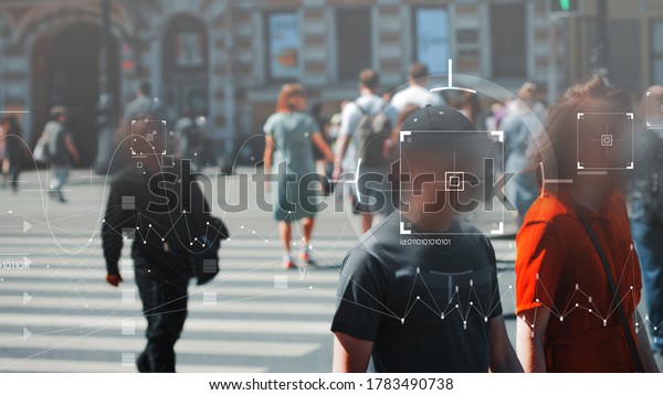 Face recognition and personal identification\
technologies in street surveillance cameras, law enforcement\
control. crowd of passers-by with graphic elements. Privacy and\
personal data protection,
