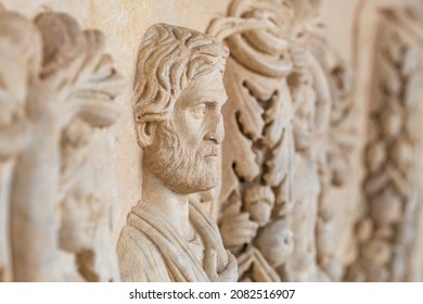Face relief of an ancient man on the ruins of tomb in ancient city of Ephesus, Turkey.