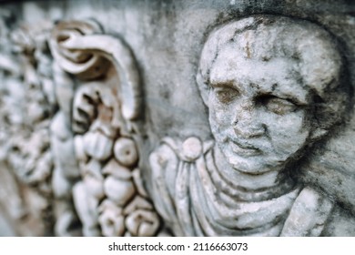 Face Relief on the ruins of tomb in ancient city of Ephesus, Turkey. Shallow DOF
