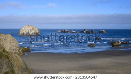 Face Rock sea stack with Cat and Kittens Rock formation off Central Oregon Coast in Pacific Ocean at Bandon
