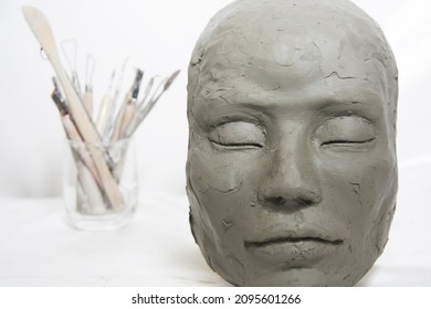 Face sculpture. Female test in clay with artistic tools. Study, modelling technique.
 - Shutterstock ID 2095601266