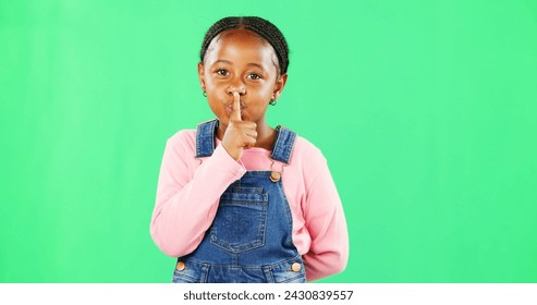 Face, secret and black girl with finger on lips, silence and happiness against studio background. Portrait, African American female child and young person with gesture for quiet, kid and green screen - Powered by Shutterstock