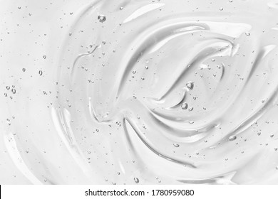 Face serum or gel texture. Clear skincare cream with bubbles background. Transparent cosmetic gel product strokes closeup  - Shutterstock ID 1780959080