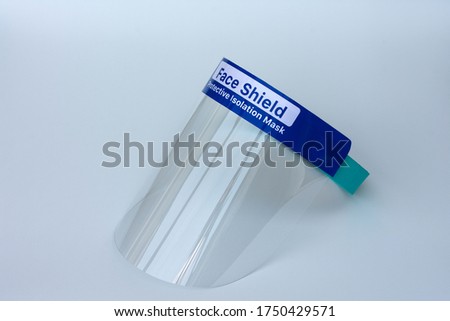 Face shield or protective isolation mask on a white background.