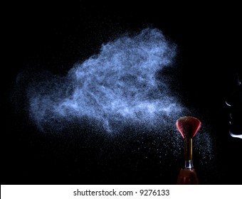 Face silhouette blowing to red brush with powder. Powder cloud. Black background. - Powered by Shutterstock