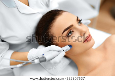 Face Skin Care. Close-up Of Woman Getting Facial Hydro Microdermabrasion Peeling Treatment At Cosmetic Beauty Spa Clinic. Hydra Vacuum Cleaner. Exfoliation, Rejuvenation And Hydratation. Cosmetology.  Stock fotó © 