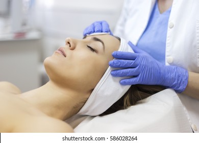 Face Skin Care. Woman In Beauty Salon