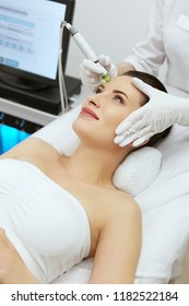 Face Skin Care. Woman Getting Facial Hydro Exfoliating Treatment