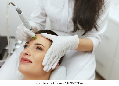 Face Skin Care. Woman Getting Facial Hydro Exfoliating Treatment