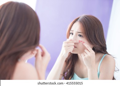 Face Skin Problem - Skin Care Woman Unhappy Touch Her Acne And Look Mirror. Asian Beauty