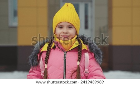 face smiling child girl daughter, winter clothes child schoolboy, childish smile face, child kid winter hat, jacket with backpack smiling outdoors, happy kid winter, happy family, childhood dream