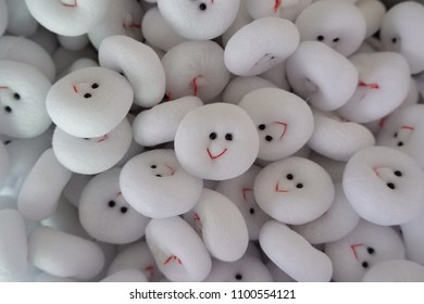 The face of smiling white dolls.