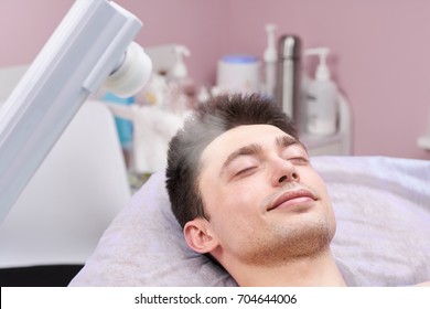 Face Steaming In Cosmetology Clinic. Healthy Man With Eyes Closed.