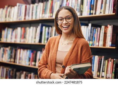 Face, student and woman in university in library ready for learning. Portrait, education and happy female from Brazil standing by bookshelf with book for studying, knowledge and literature research. - Powered by Shutterstock