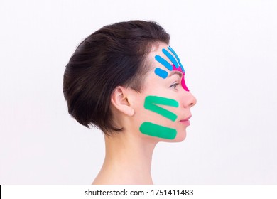 Face taping, close-up of a girls face with cosmetological anti-wrinkle tape. Face aesthetic taping. Non-invasive anti-aging lifting method for reduction of wrinkles